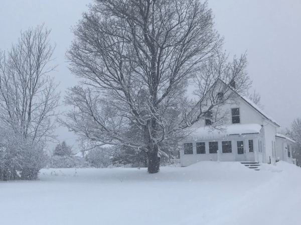 winter snow at rural farmhouse